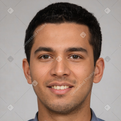 Joyful white young-adult male with short  black hair and brown eyes