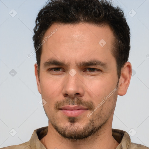 Joyful white young-adult male with short  brown hair and brown eyes