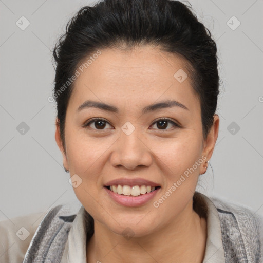 Joyful asian young-adult female with short  brown hair and brown eyes