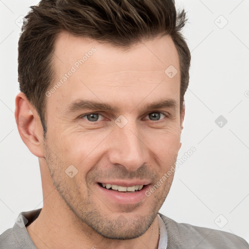 Joyful white adult male with short  brown hair and brown eyes