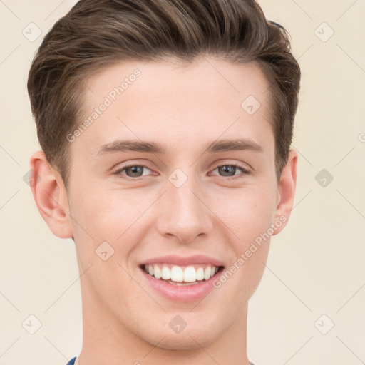 Joyful white young-adult male with short  brown hair and grey eyes