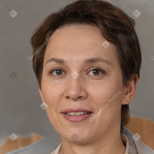 Joyful white adult female with short  brown hair and brown eyes