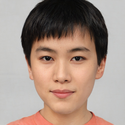 Joyful asian child male with short  black hair and brown eyes