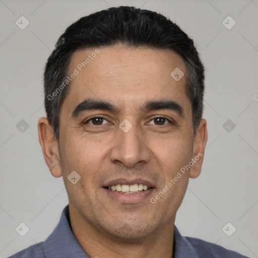 Joyful white young-adult male with short  black hair and brown eyes