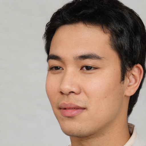 Neutral asian young-adult male with short  black hair and brown eyes