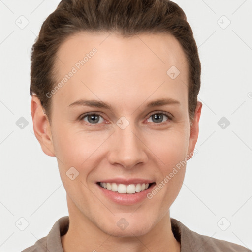 Joyful white young-adult female with short  brown hair and grey eyes