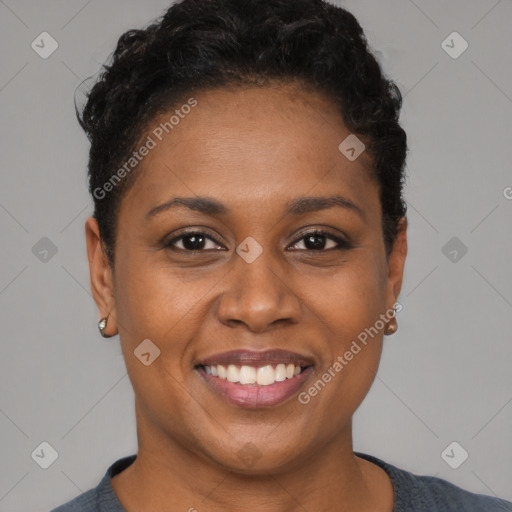 Joyful black young-adult female with short  brown hair and brown eyes