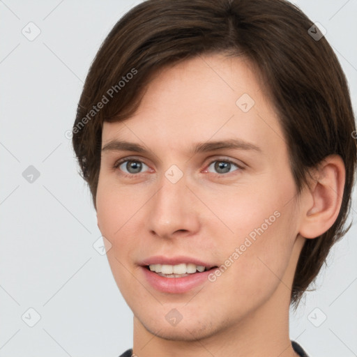 Joyful white young-adult female with short  brown hair and grey eyes