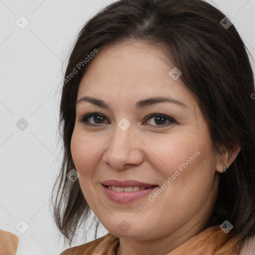 Joyful white adult female with medium  brown hair and brown eyes