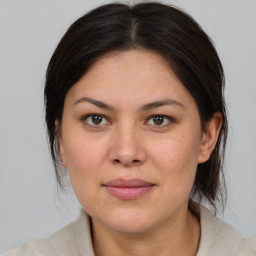 Joyful white adult female with medium  brown hair and brown eyes