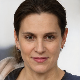 Joyful white adult female with short  brown hair and brown eyes