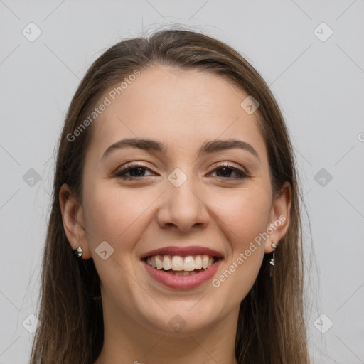 Joyful white young-adult female with long  brown hair and grey eyes