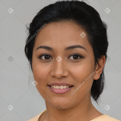 Joyful latino young-adult female with medium  brown hair and brown eyes