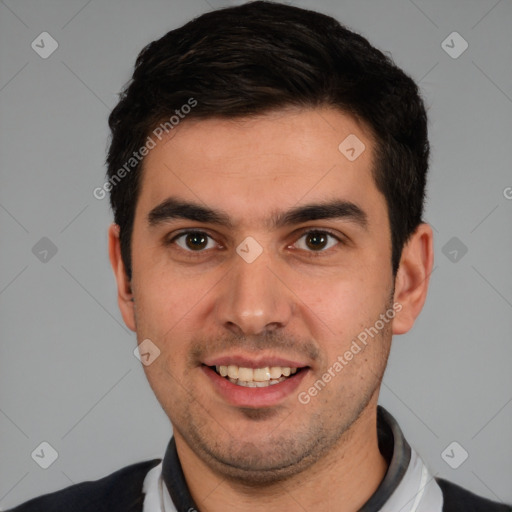 Joyful white young-adult male with short  black hair and brown eyes