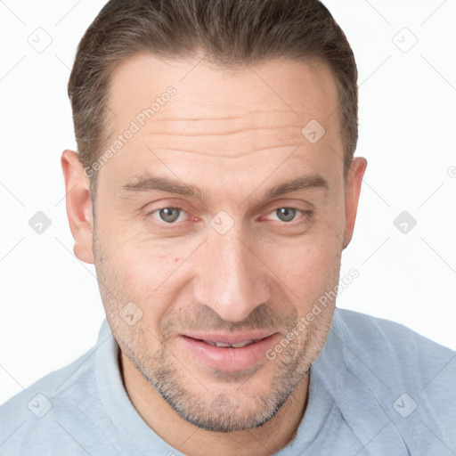 Joyful white adult male with short  brown hair and brown eyes