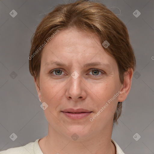 Joyful white adult female with short  brown hair and grey eyes