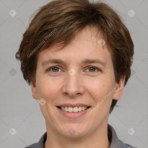 Joyful white adult female with short  brown hair and grey eyes