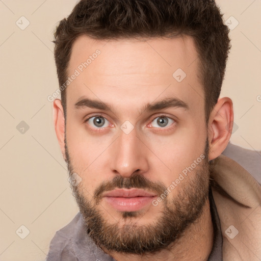 Neutral white young-adult male with short  brown hair and brown eyes