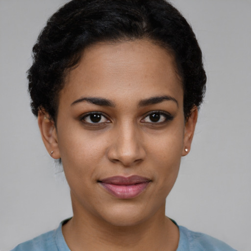 Joyful latino young-adult female with short  brown hair and brown eyes