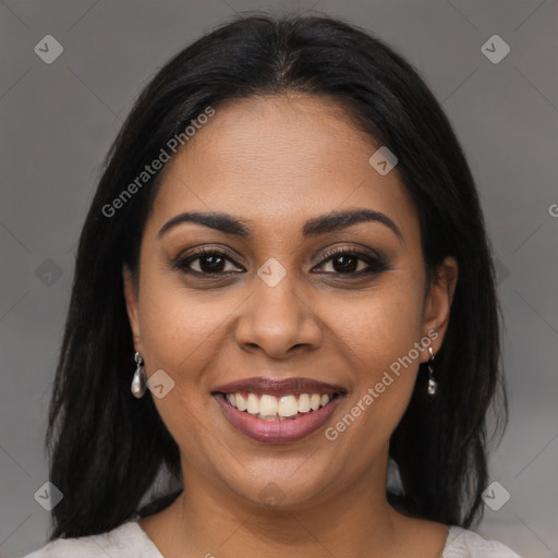 Joyful latino young-adult female with medium  brown hair and brown eyes