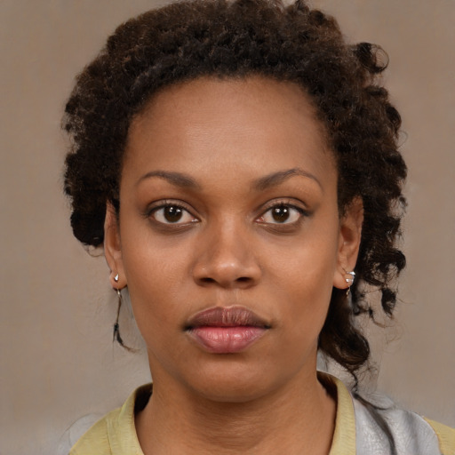 Neutral black young-adult female with medium  brown hair and brown eyes