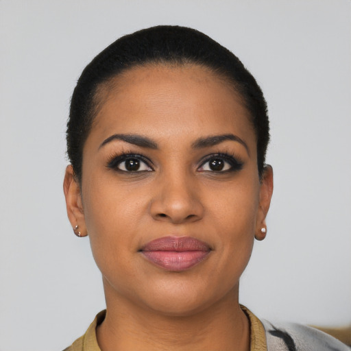 Joyful latino young-adult female with short  brown hair and brown eyes
