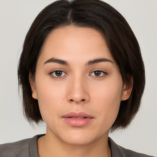 Neutral white young-adult female with medium  brown hair and brown eyes