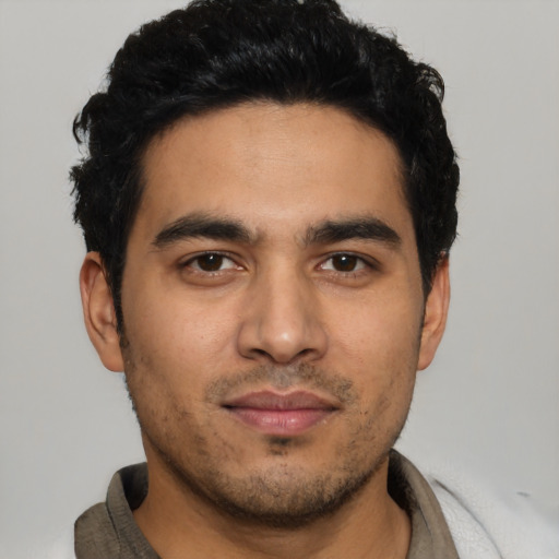 Neutral latino young-adult male with short  black hair and brown eyes