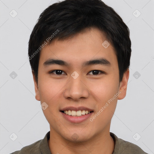 Joyful asian young-adult male with short  brown hair and brown eyes