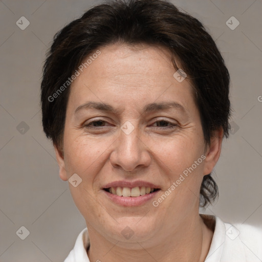 Joyful white adult female with short  brown hair and brown eyes