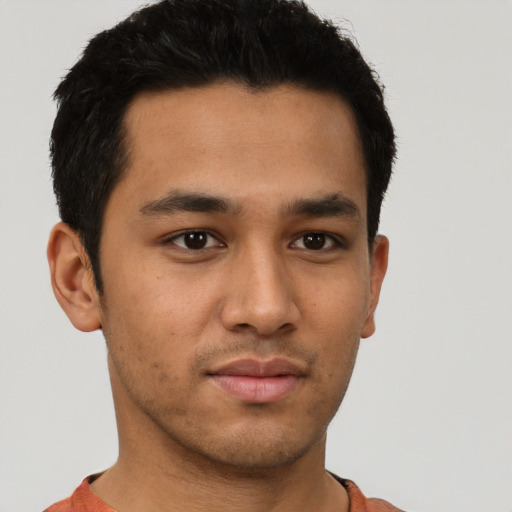 Neutral latino young-adult male with short  brown hair and brown eyes