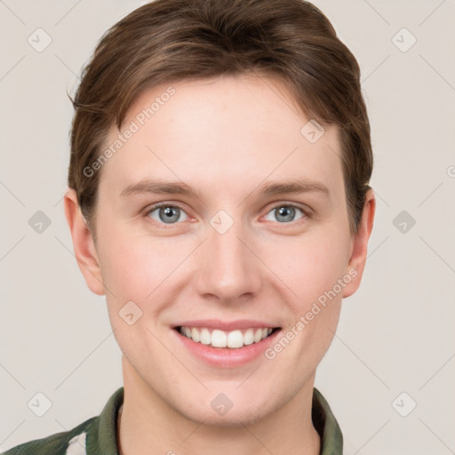 Joyful white young-adult female with short  brown hair and grey eyes