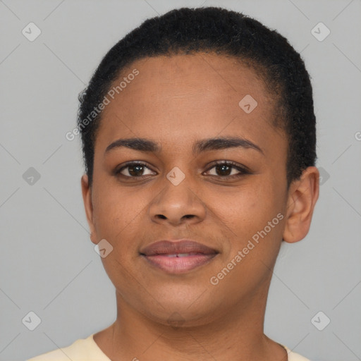 Joyful black young-adult female with short  brown hair and brown eyes