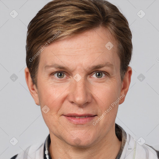 Joyful white adult male with short  brown hair and grey eyes