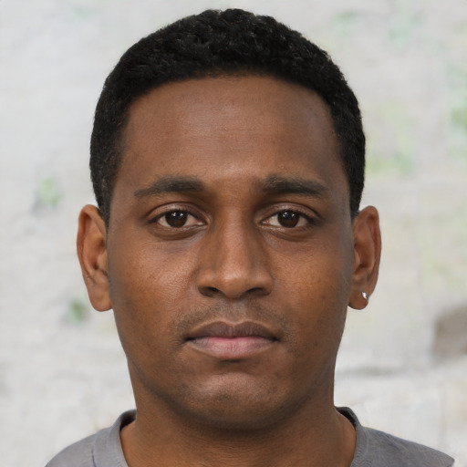 Neutral black young-adult male with short  black hair and brown eyes