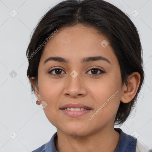 Joyful latino young-adult female with medium  brown hair and brown eyes