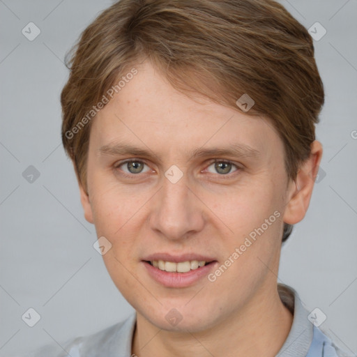 Joyful white young-adult female with short  brown hair and grey eyes