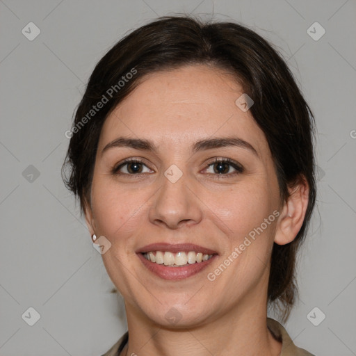 Joyful white adult female with medium  brown hair and brown eyes