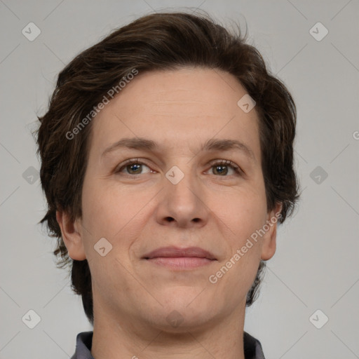 Joyful white adult female with short  brown hair and grey eyes