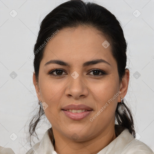 Joyful latino young-adult female with medium  brown hair and brown eyes