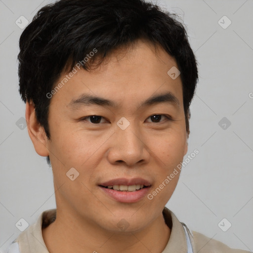 Joyful asian young-adult male with short  brown hair and brown eyes