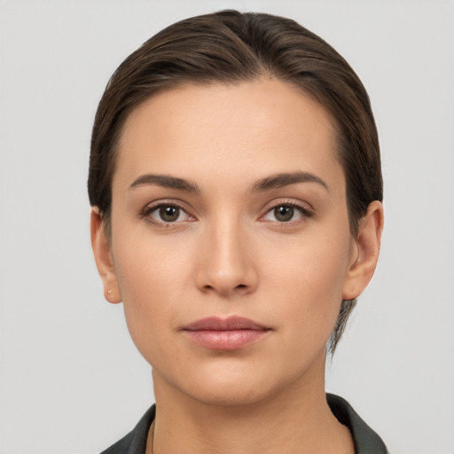 Neutral white young-adult female with short  brown hair and brown eyes