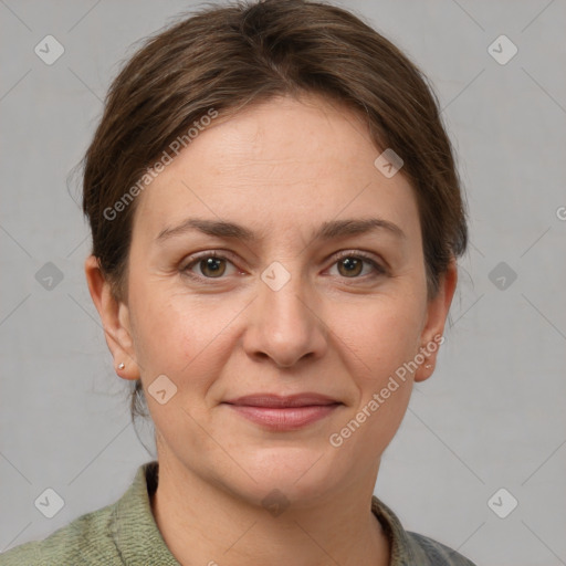 Joyful white adult female with short  brown hair and grey eyes