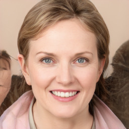 Joyful white young-adult female with medium  brown hair and blue eyes