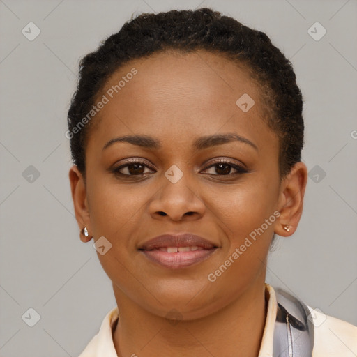 Joyful black young-adult female with short  brown hair and brown eyes