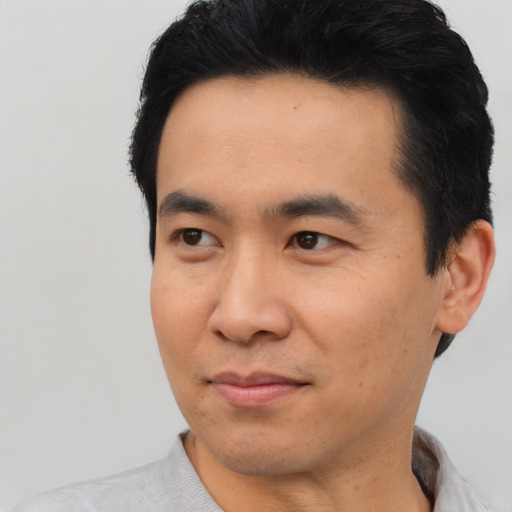 Neutral asian young-adult male with short  black hair and brown eyes
