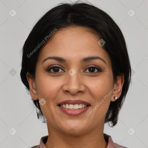 Joyful latino young-adult female with medium  brown hair and brown eyes