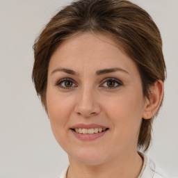 Joyful white young-adult female with medium  brown hair and brown eyes