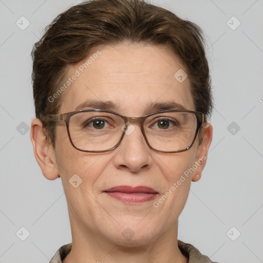 Joyful white adult female with short  brown hair and grey eyes