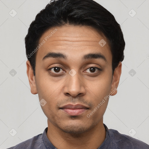 Joyful latino young-adult male with short  black hair and brown eyes